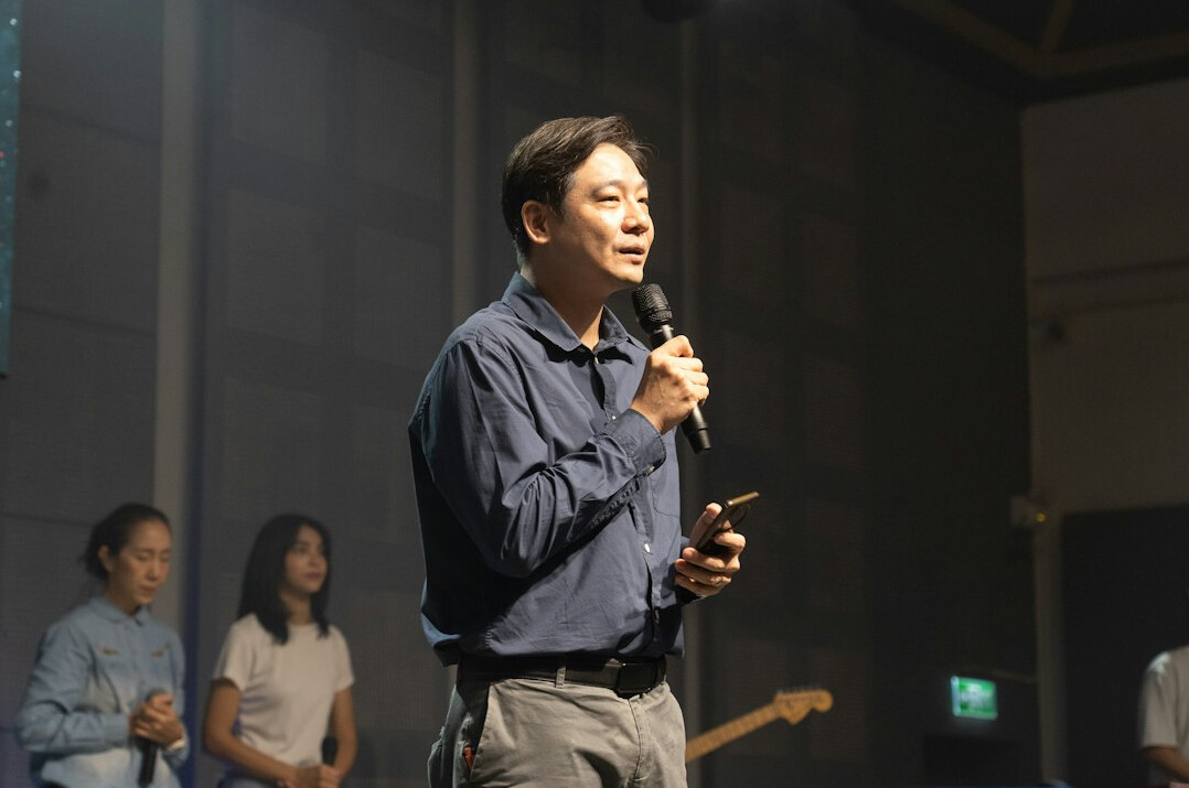 confident speaker on stage
