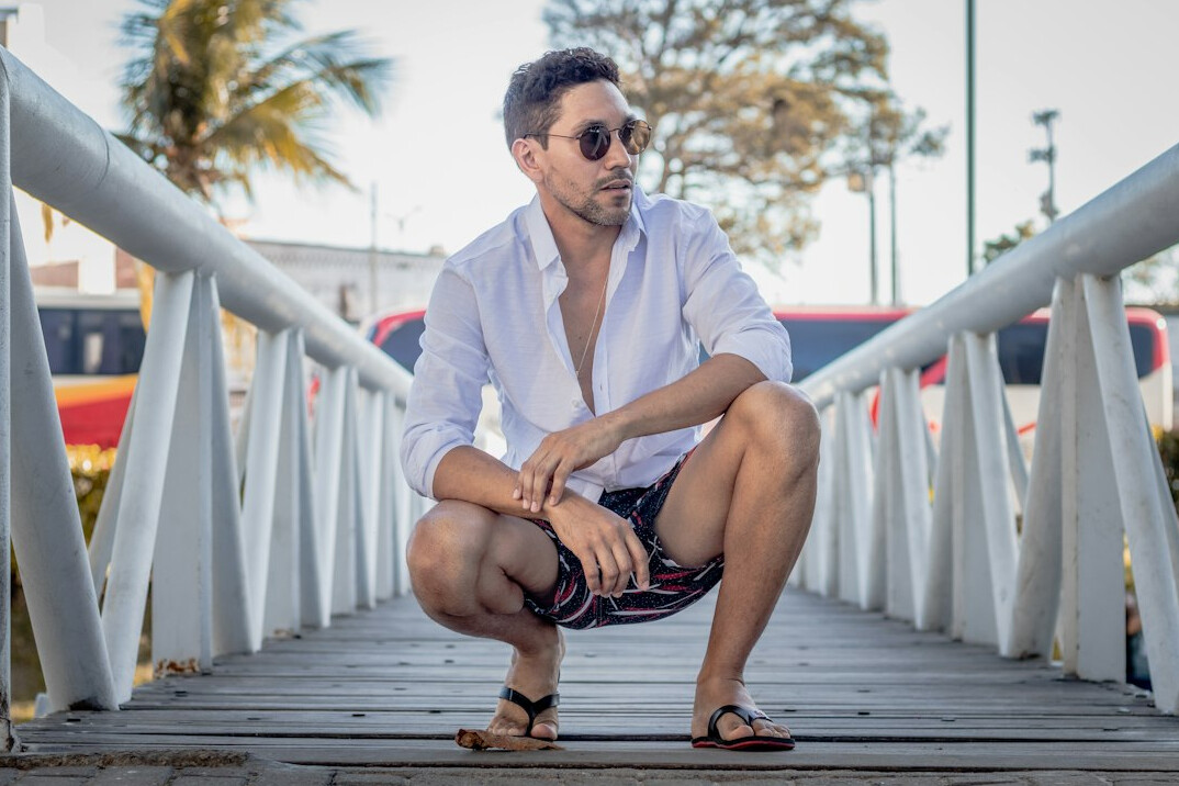 Studio portrait of a Brazilian man with short beard wearing a casual shirt