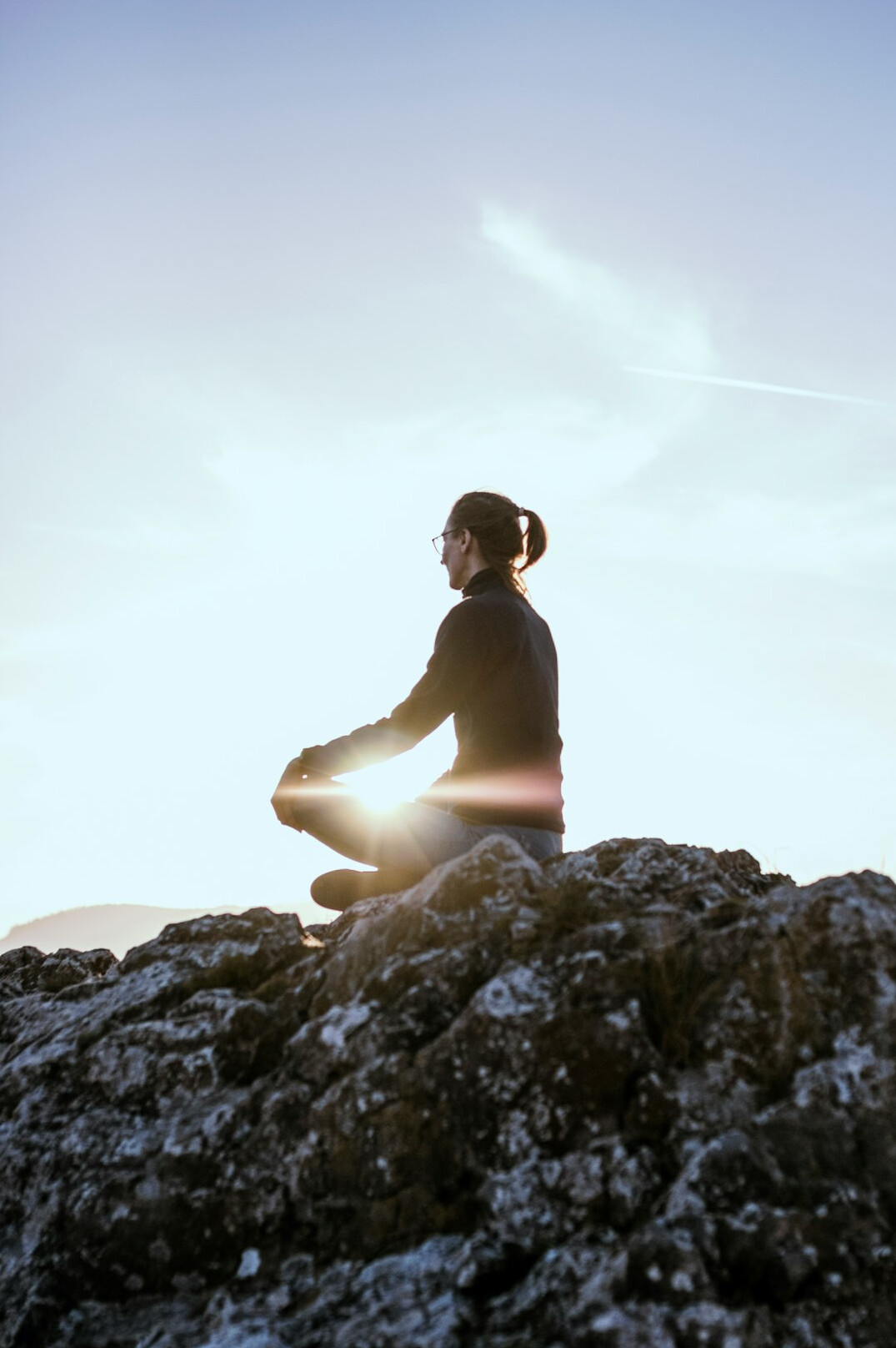 person meditating alone